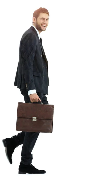 In full growth. a businessman with a leather briefcase walks up. — Stock Photo, Image