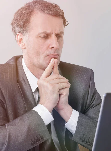 Businessman sitting at the desk in office workplace — Stock Photo, Image