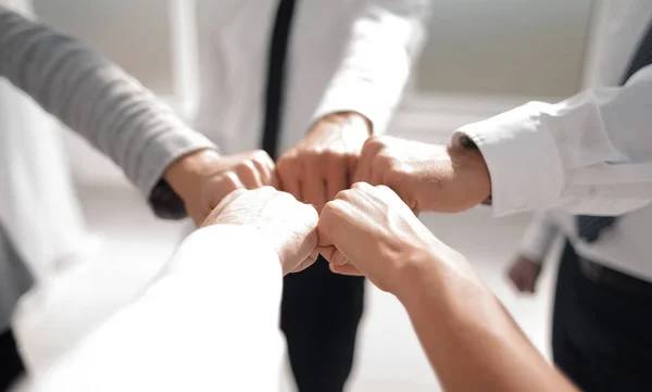 Close up .businessman and businesswoman making a fist bump on building background — Stock Photo, Image