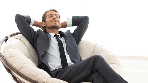 Joven hombre de negocios meditando en gran sillón cómodo —  Fotos de Stock