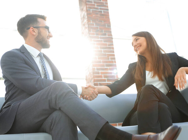 Businessman shaking hands to seal a deal with his partner
