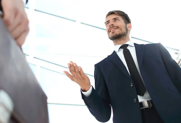 Unrecognizable businessman with suitcase close-up on a modern bu — Stock Photo, Image