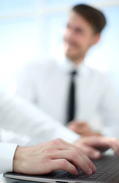 Close up of serious businessman who prints laptop — Stock Photo, Image