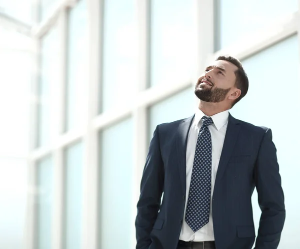 Dreaming businessman looking up at copy space. — Stock Photo, Image