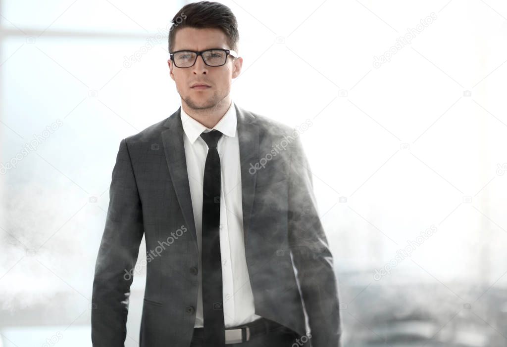 young businessman in a smoky office