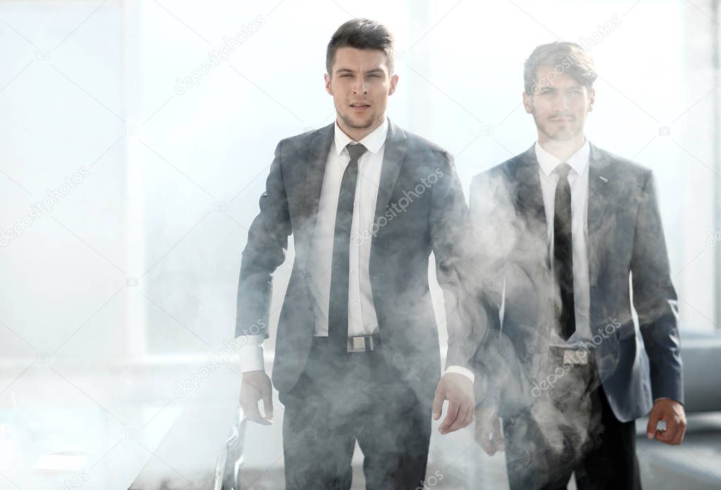 businessmen leave the office in smoke