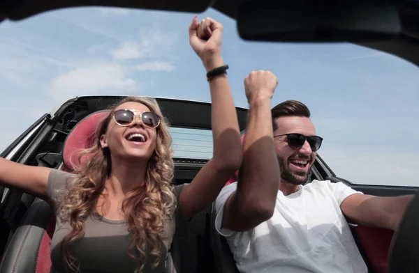 Close up.a loving couple travelling in a convertible. — Stock Photo, Image