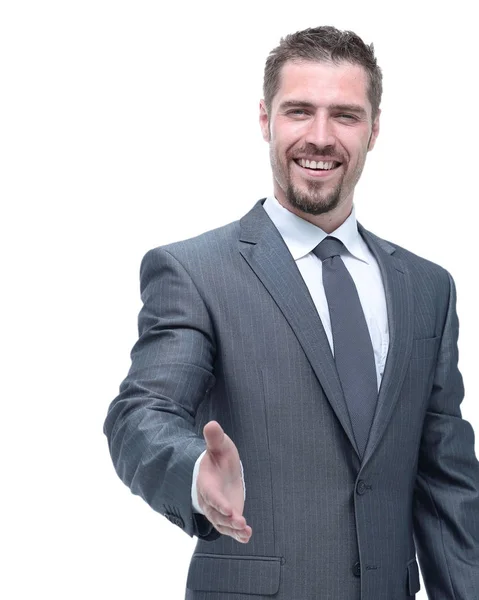 Sorridente empresário estende a mão para um aperto de mão — Fotografia de Stock