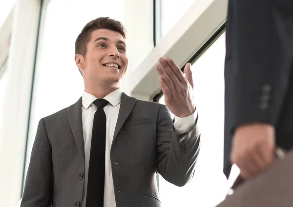 Close up.business people standing near the office window — Stock Photo, Image