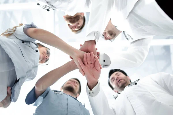 Health care workers demonstrating unity, bottom view — Stock Photo, Image