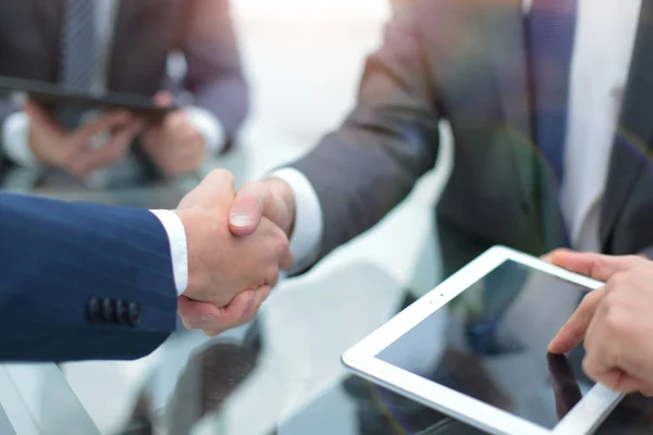 Men shaking hands with smile at office with their coworkers. — Stock Photo, Image