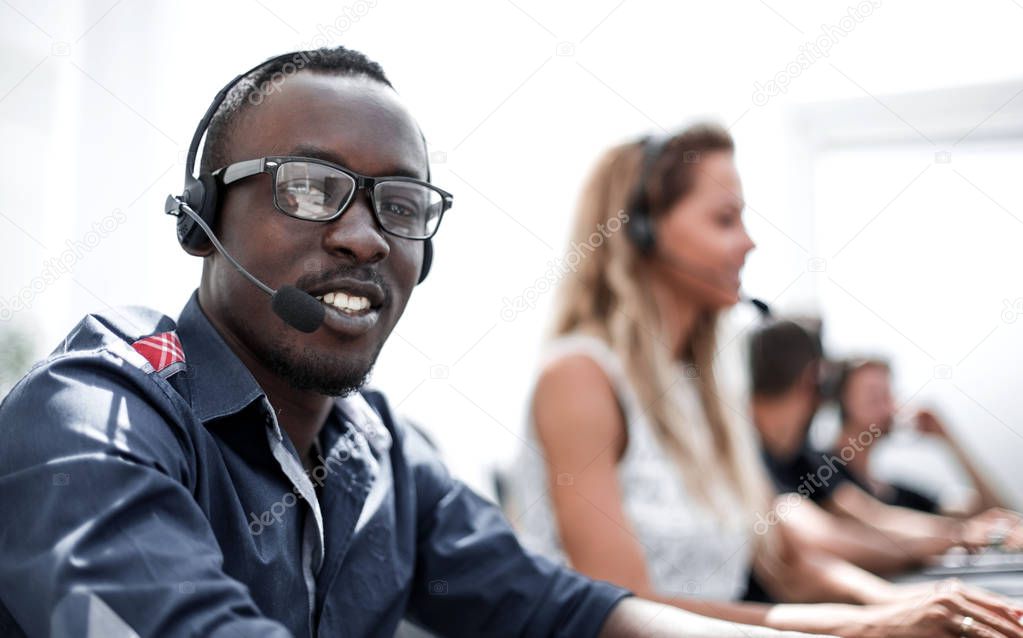call center employee on the background of colleagues