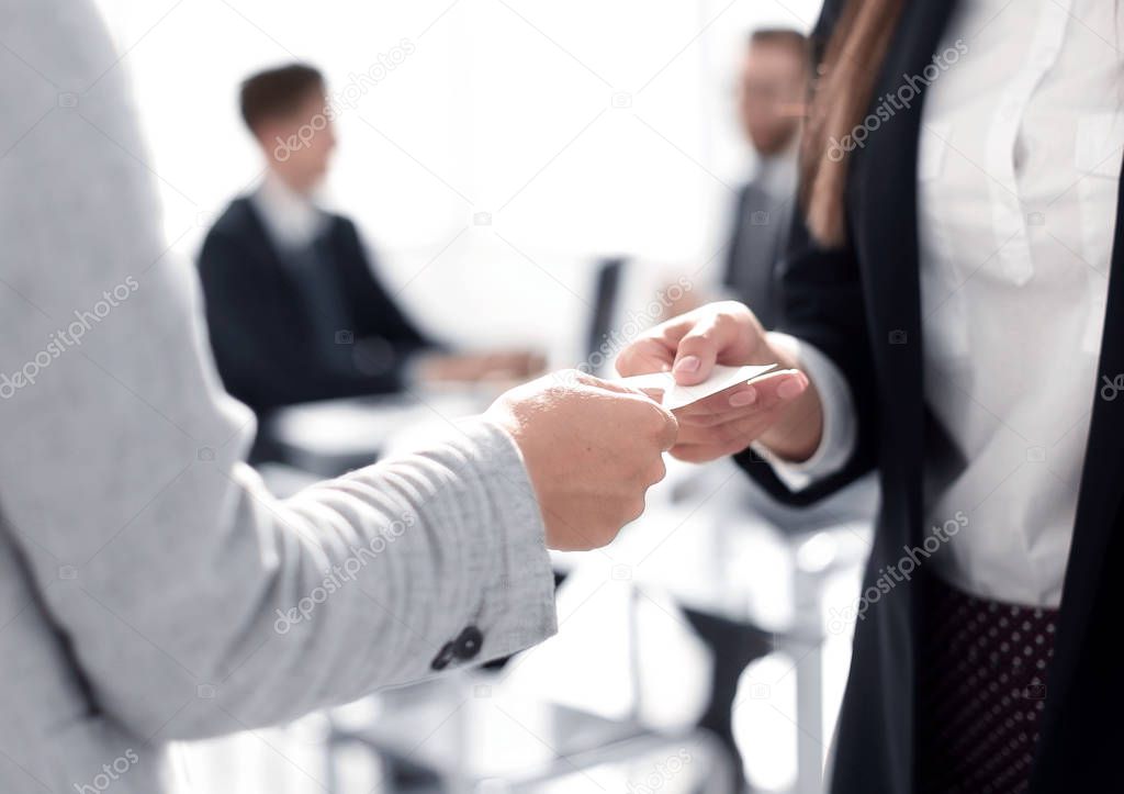 close up.two business woman exchanging business card