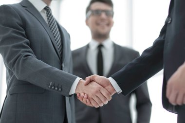 close up.welcome handshake of business people clipart