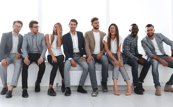 Young people are waiting for an interview, sitting in the office lobby — Stock Photo, Image