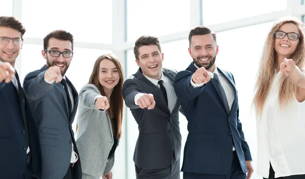Happy business team pointing at you. — Stock Photo, Image