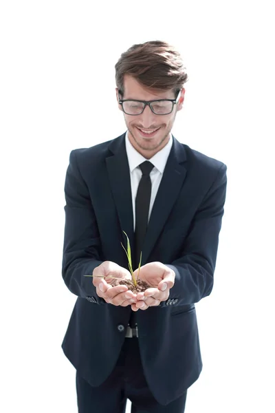 Joven empresario sosteniendo un brote — Foto de Stock