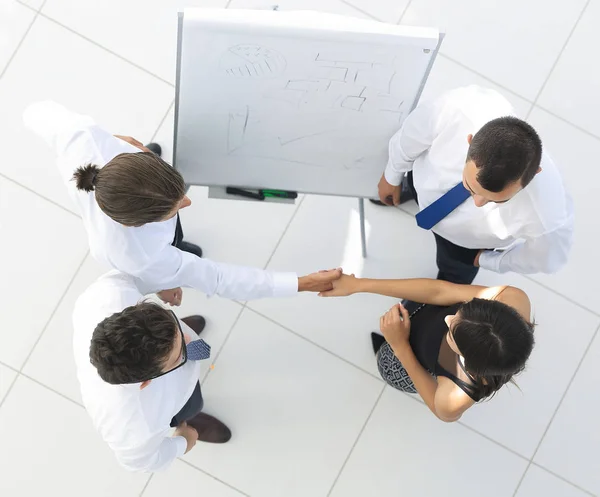 View from the top. the background image of a business handshake colleagues — Stock Photo, Image