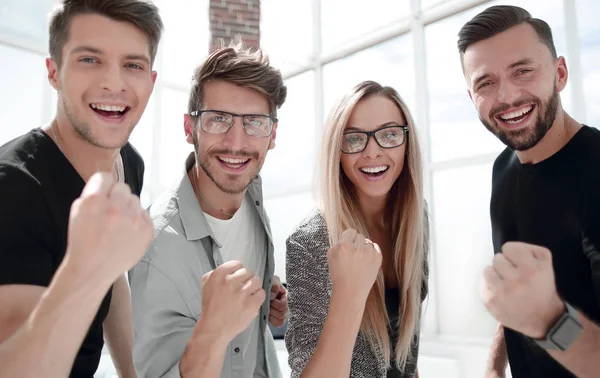 Business team celebrating a good job in the office — Stock Photo, Image