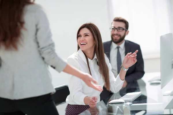 Smiling employees talking in the workplace. — Stock Photo, Image