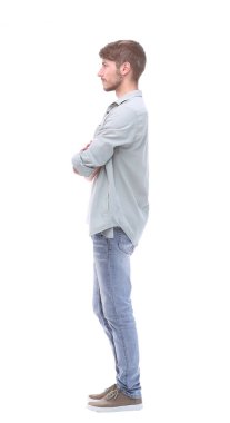yan görünümü. kendine güvenen genç adam kot pantolon
