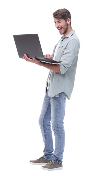 In full growth.smiling young man with laptop — Stock Photo, Image