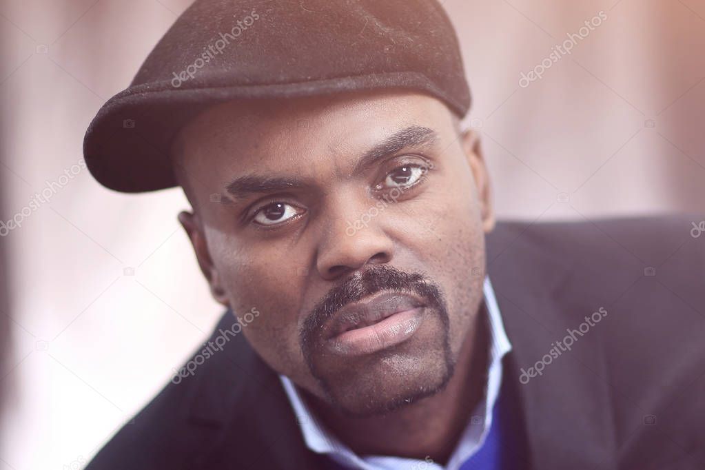 African American man posing with hand on his chin
