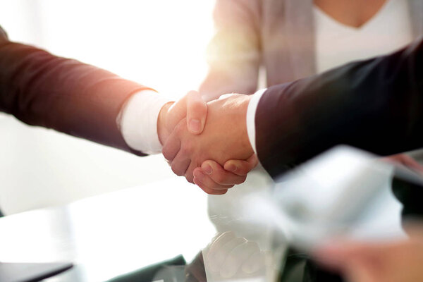 confident handshake of business partners