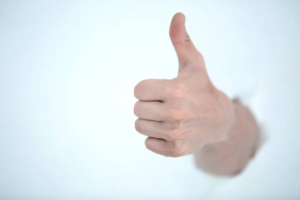 Gesto de la mano con el pulgar hacia arriba sobre un fondo claro — Foto de Stock