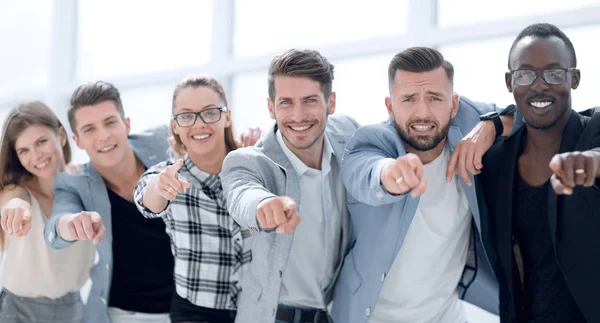 Group of people pointing at the camera and smiling - isolated — Stock Photo, Image