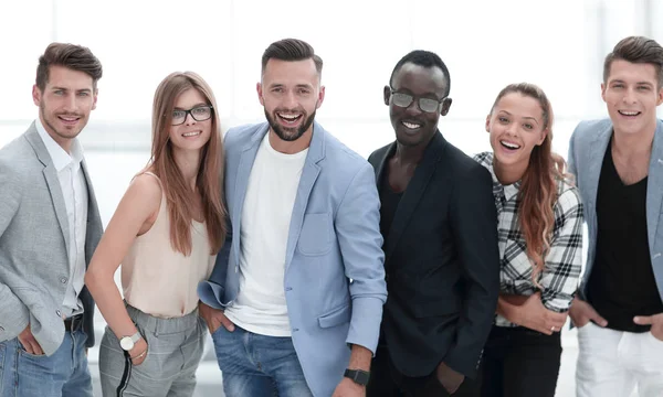 Happy Group of People Standing in a Row Over White Background — стоковое фото