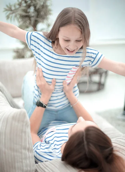 Close up. Happy mom and daughter play together — стоковое фото