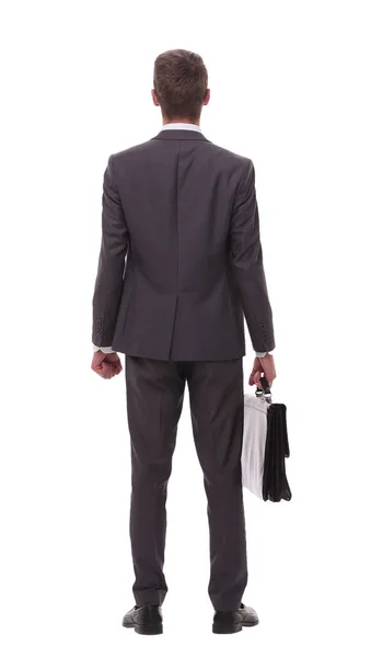 Вид сзади. бизнесмен с кожаным портфелем рассматривает пространство для копирования — стоковое фото