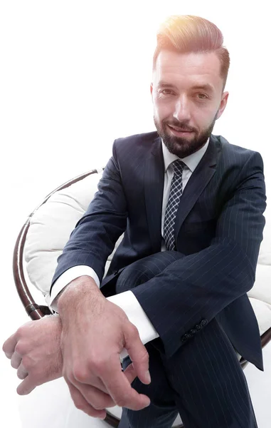 Successful businessman sitting in a chair. — Stock Photo, Image