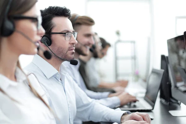 Close up.background image of call center employees in the workplace — Stock Photo, Image