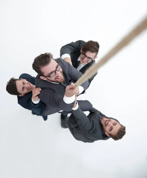 Vista superior. Equipe de negócios ajuda o chefe a subir . — Fotografia de Stock