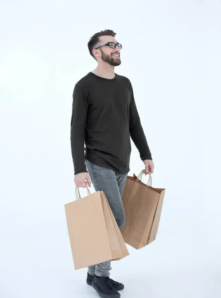 Portrait of a man with a full paper bag on a gray — Stock Photo, Image