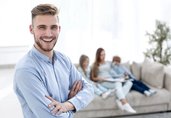 Smiling man standing in his living room — Stock Photo, Image