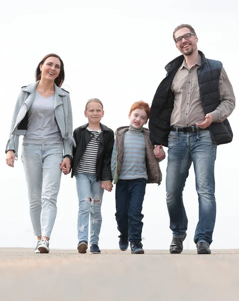 Parents with their children walking along together — Stock Photo, Image