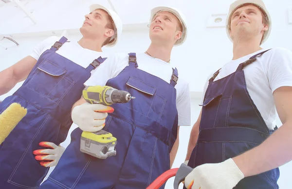 Equipe profissional de construtores com ferramentas — Fotografia de Stock