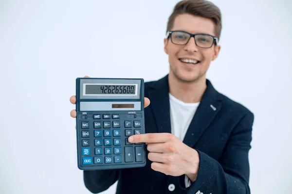 Close up.smiling businessman showing calculator — Stock Photo, Image