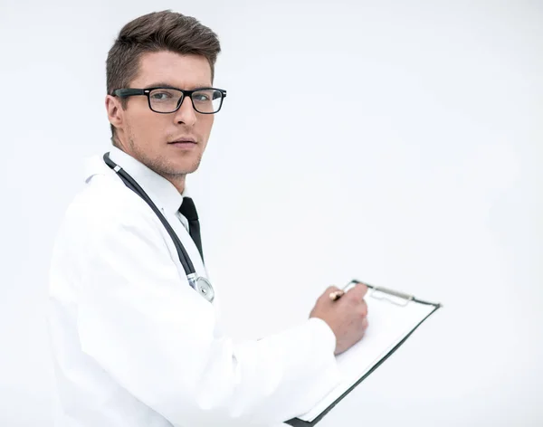 doctor signing the medical report