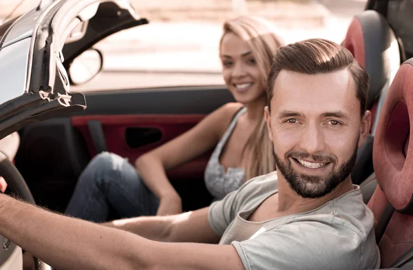 Top view.a young man traveling in a convertible car — Stock Photo, Image