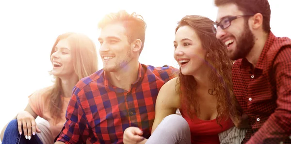 Young friends sitting on the couch and rooting for their favorit — Stock Photo, Image