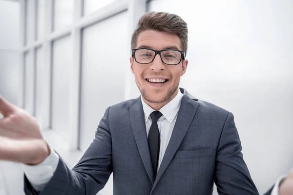 Surprised young businessman standing near the window. — Stock Photo, Image