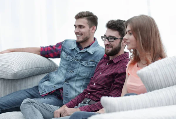 Group of young people going on the couch. — Stock Photo, Image