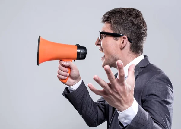 Fierce employee with a megaphone — Stock Photo, Image