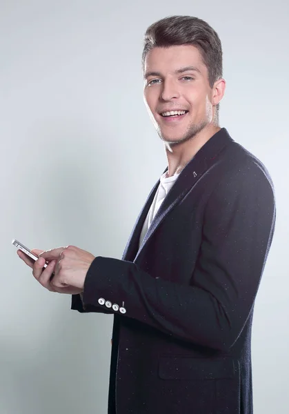 Young guy in a jacket talking on the phone — Stock Photo, Image