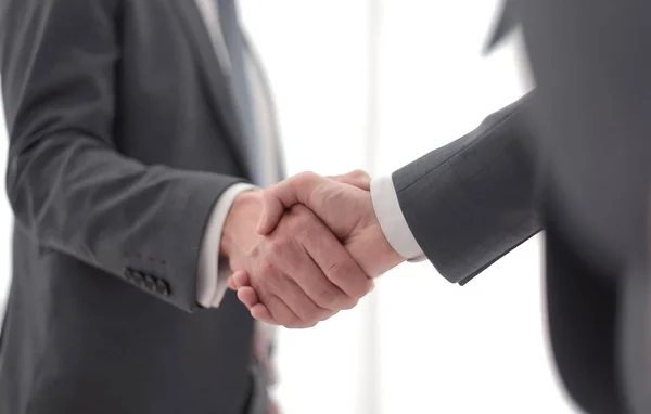 Close up. handshake of business people on a light background. — Stock Photo, Image