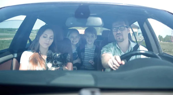 Happy family travelling by car — Stock Photo, Image